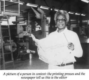 man in front of presses